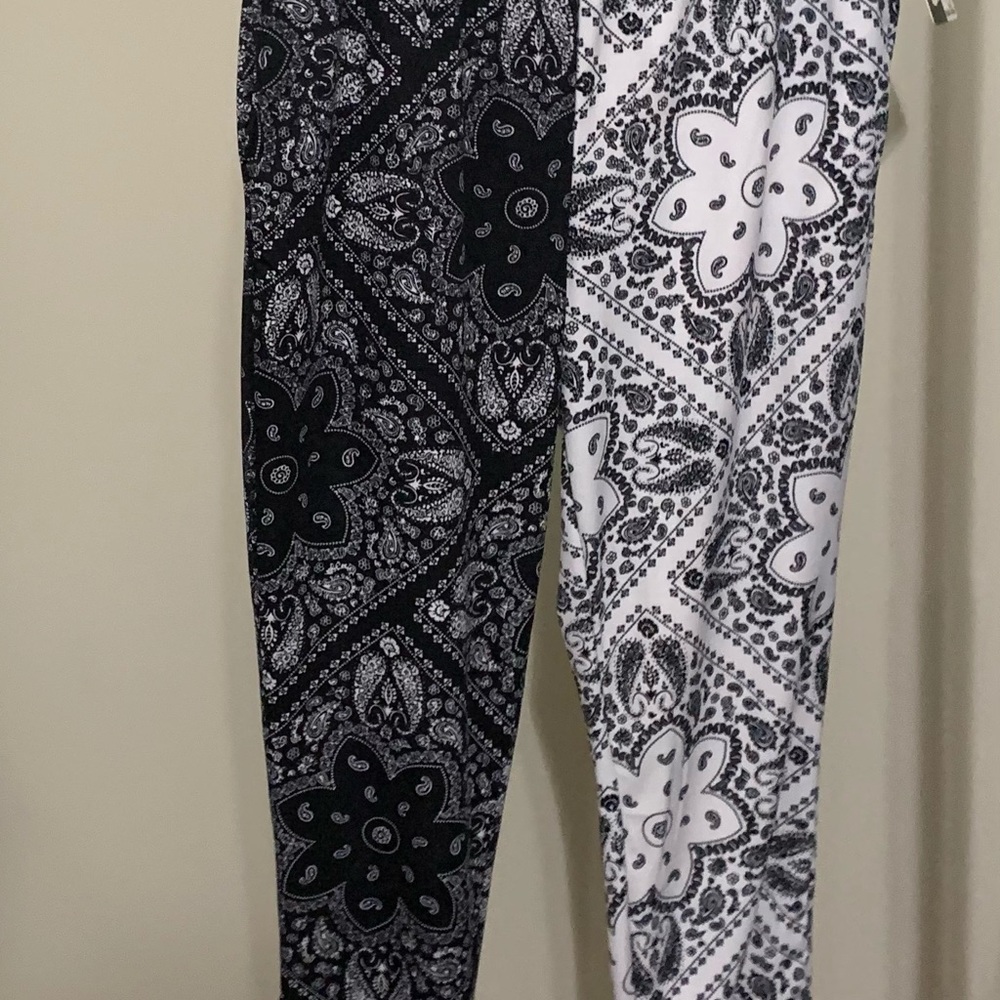Pants black with white tie in the bottom
